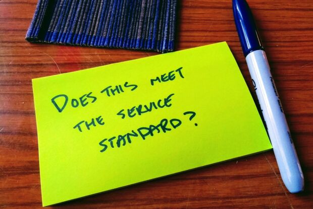 Post-it note with the following question written, does this meet the service standard?