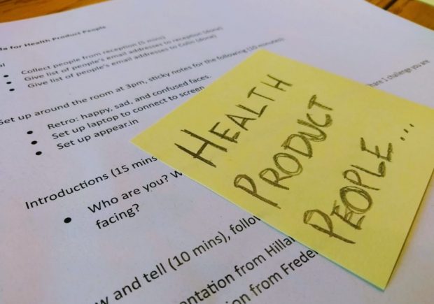 A printout of the agenda for Health Product People covered with a sticky note saying Health Product People. Only some words on the agenda are readable eg Introductions, Retro